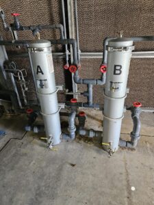 Side stream filtration for cooling towers reducing suspended solids (TSS)