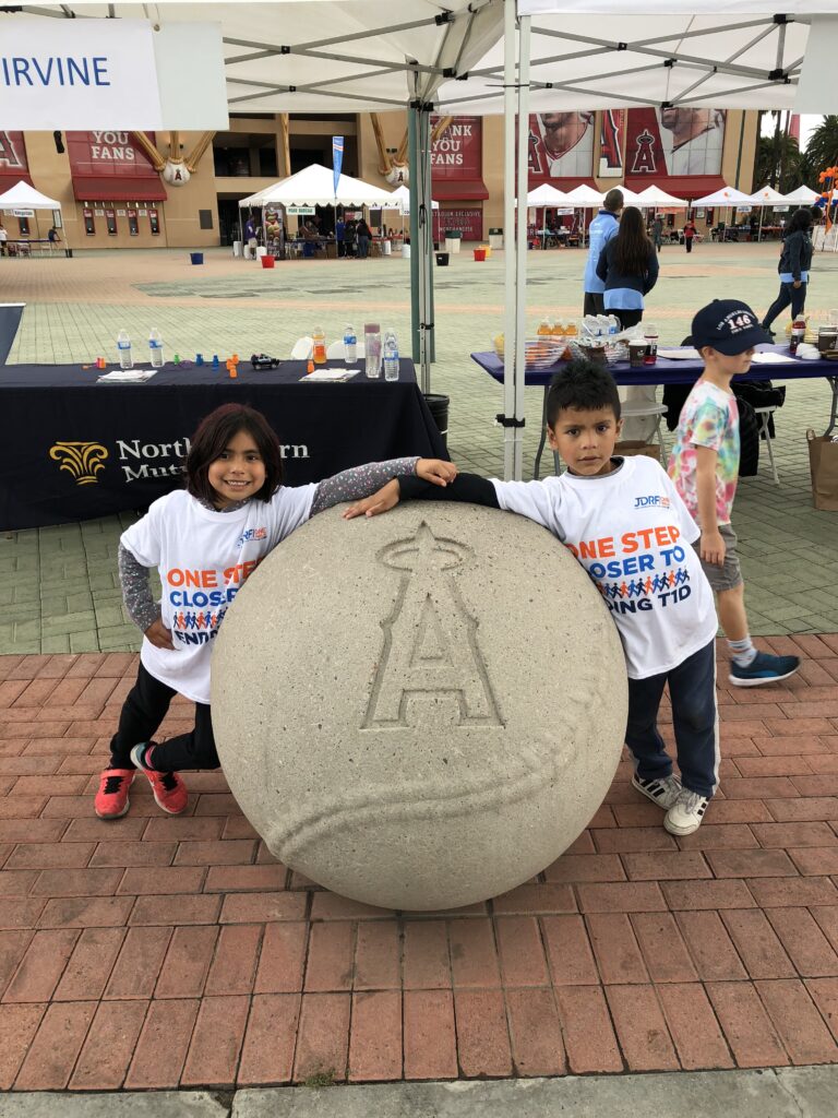 Glacier Giving with two kids holding hands